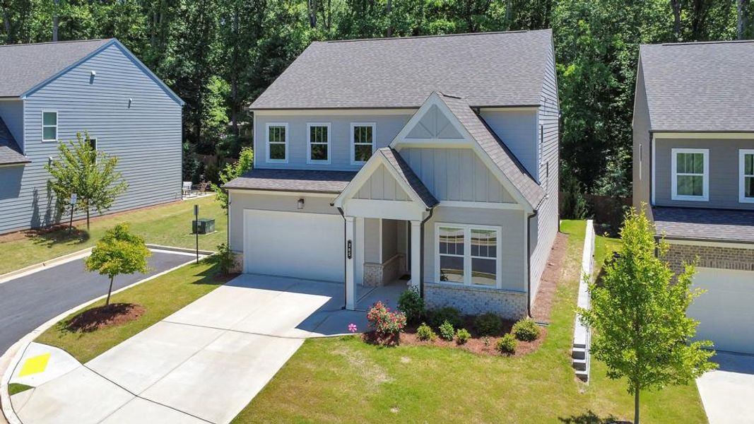 Front exterior of a new home in , Holly Springs, GA, highlighting curb appeal (Image 29). Front exterior of a new home in , Holly Springs, GA, highlighting curb appeal (Image 29).