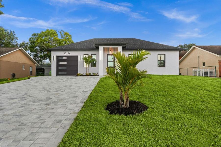 Front exterior of a new home in , North Fort Myers, FL, highlighting curb appeal (Image 2). Front exterior of a new home in , North Fort Myers, FL, highlighting curb appeal (Image 2).