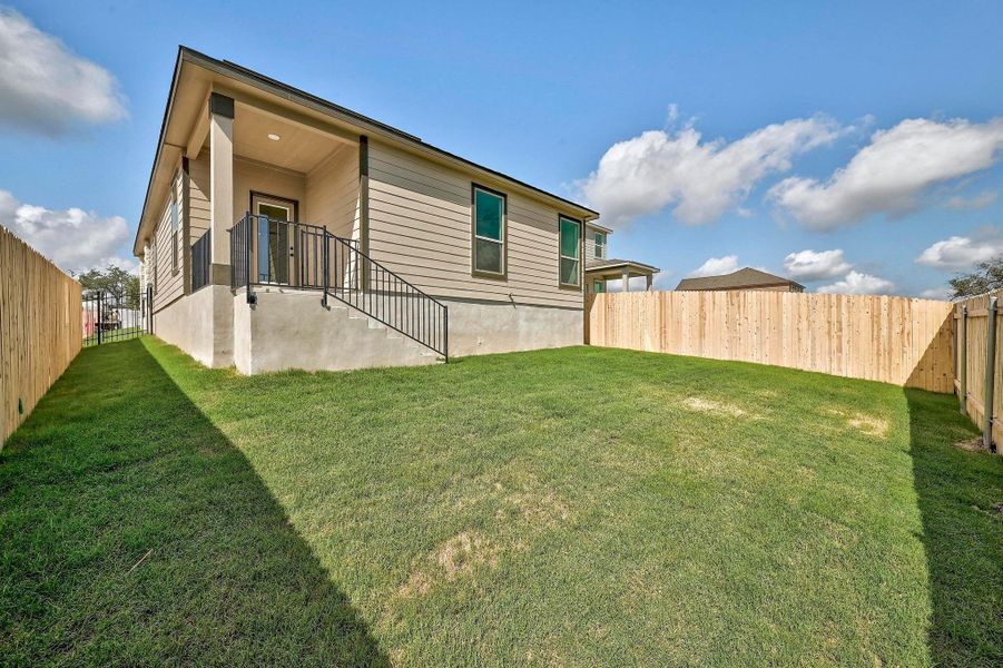 Front exterior of a new home in Creekside at Estancia, Austin, TX, highlighting curb appeal (Image 18).