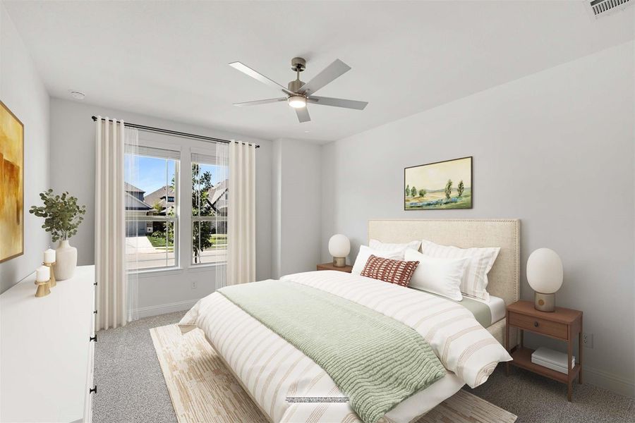 Bedroom with upholstered headboard, ceiling fan, carpet flooring, and large window with sheer curtains Bedroom with upholstered headboard, ceiling fan, carpet flooring, and large window with sheer curtains
