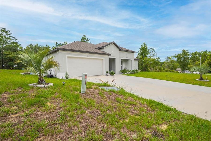 Front exterior of a new home in , Homosassa, FL, highlighting curb appeal (Image 2). Front exterior of a new home in , Homosassa, FL, highlighting curb appeal (Image 2).
