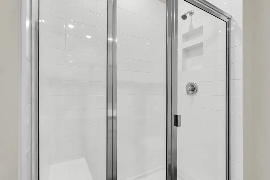 Elevated design continues into the serene primary bathroom.