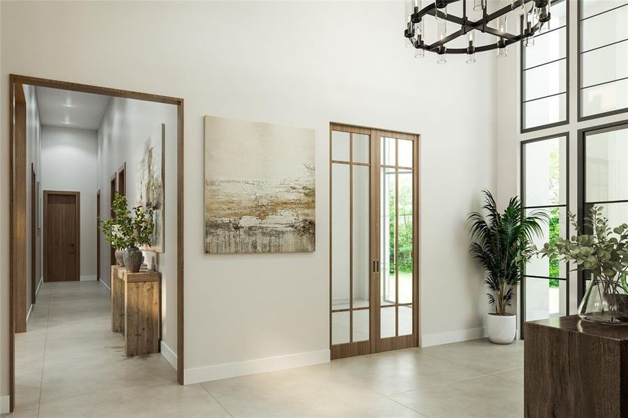 Expansive foyer featuring a high ceiling, large-format tile flooring, a contemporary chandelier, and full-height windows