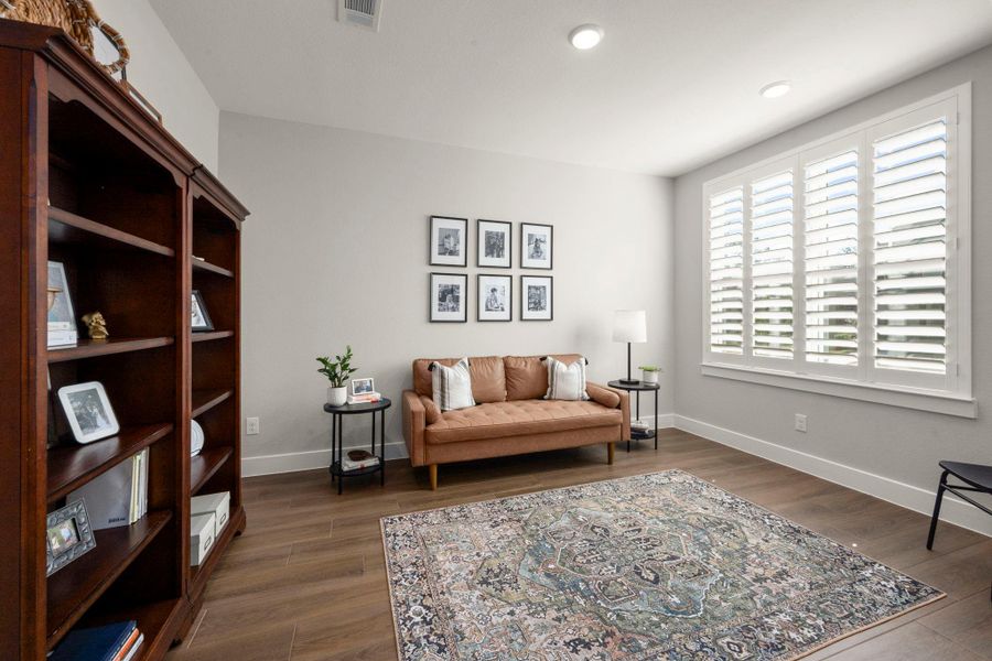 The private study with double glass doors offers both privacy and connection. A large front window fills the space with natural light. The private study with double glass doors offers both privacy and connection. A large front window fills the space with natural light.