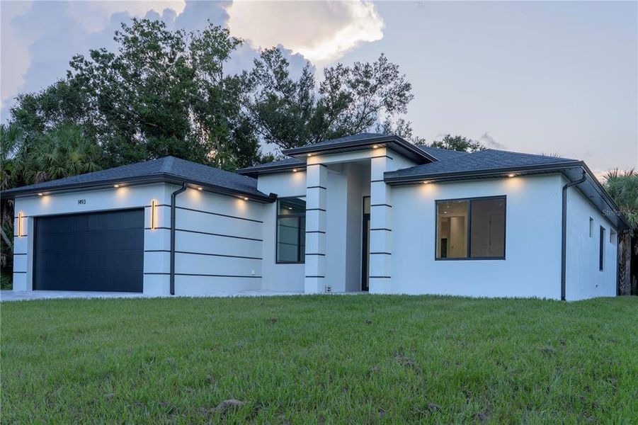 Front exterior of a new home in , North Port, FL, highlighting curb appeal (Image 30).