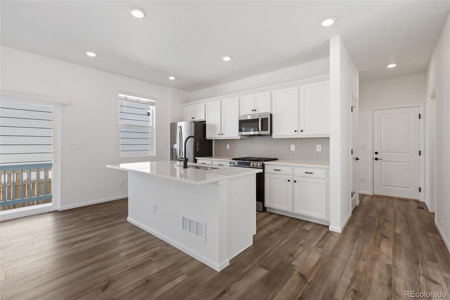 Furnished interior view inside a new home in Woodrose at Painted Prairie, Aurora (Image 4).