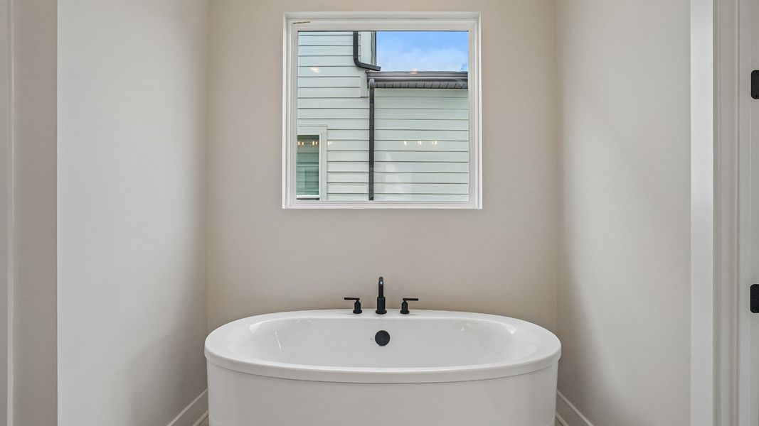 Freestanding tub in primary bathroom