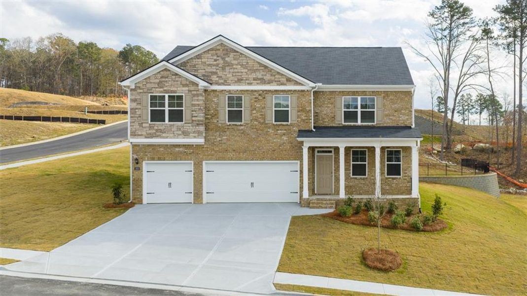 Front exterior of a new home in , Dacula, GA, highlighting curb appeal (Image 2).