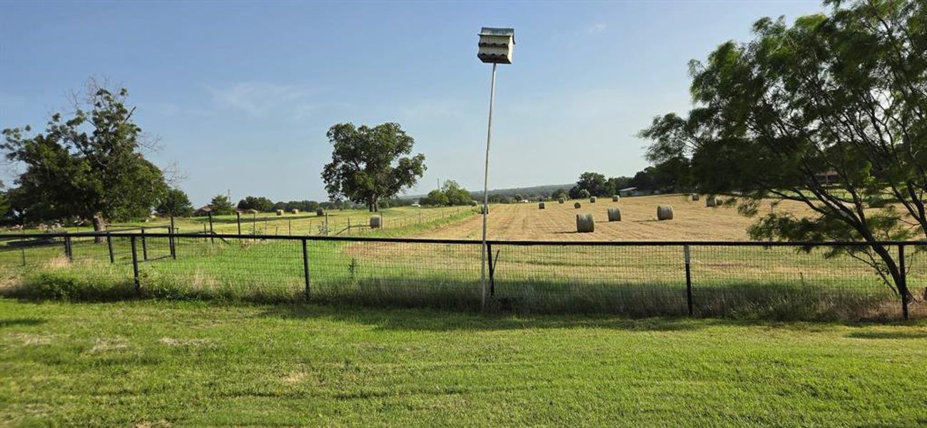 A view of a portion of the hay bales cut on 12 of the 14 acres. This is horse grade hay worth about $100.00 per bale. This is a working farm and the hay helps pay the bills. A view of a portion of the hay bales cut on 12 of the 14 acres. This is horse grade hay worth about $100.00 per bale. This is a working farm and the hay helps pay the bills.