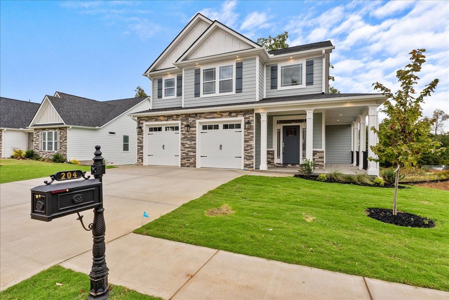 Representative exterior photo of a completed home built from the Emilia Elite by Enchanted Homes in Smokey Hills, Campobello, SC (Image 26).