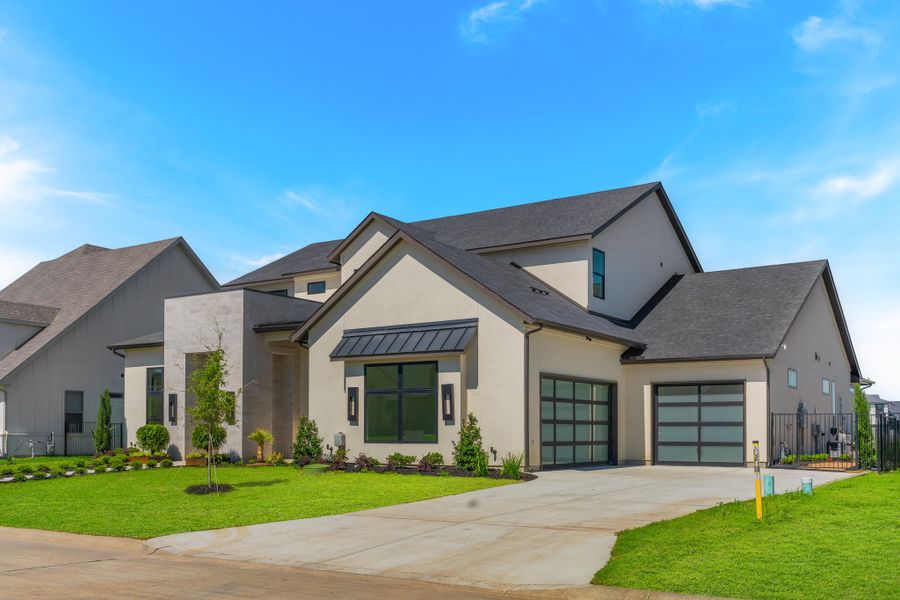 Front exterior of a new home in The Resort on Eagle Mt. Lake, Fort Worth, TX, highlighting curb appeal (Image 2). Front exterior of a new home in The Resort on Eagle Mt. Lake, Fort Worth, TX, highlighting curb appeal (Image 2).