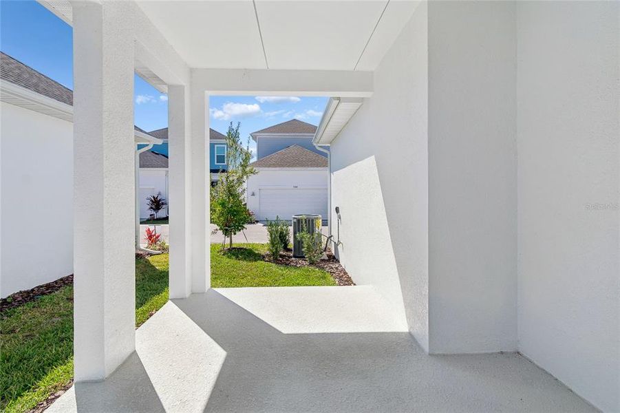 Exterior details and patio area of a home in Emerald Landing at Waterside at Lakewood Ranch – Cottage Series, Sarasota (Image 3).