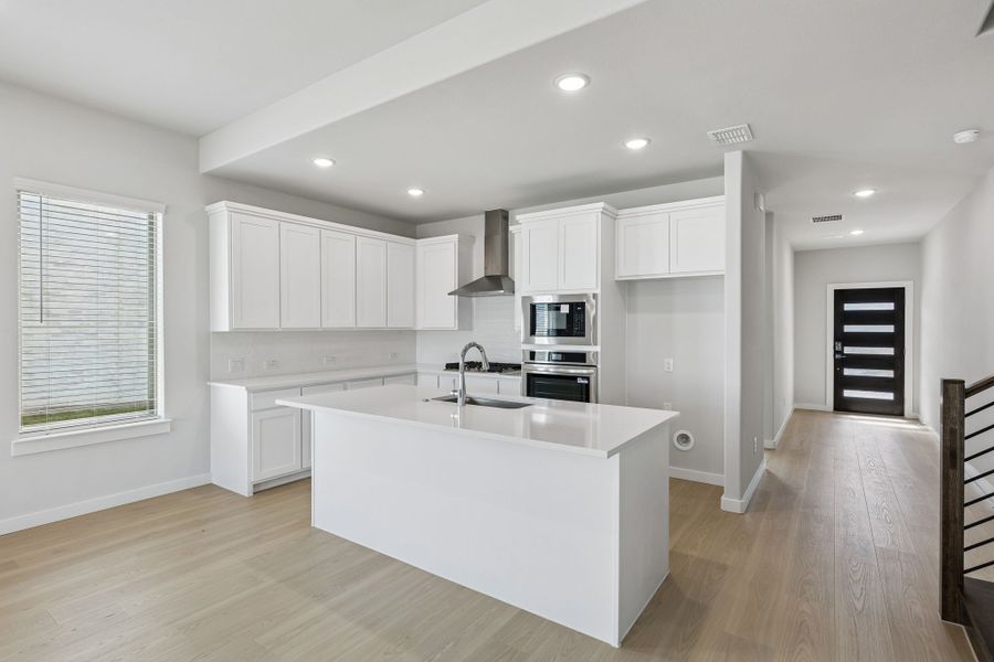 Kitchen in the Stanley II home plan by Trophy Signature Homes – REPRESENTATIVE PHOTO