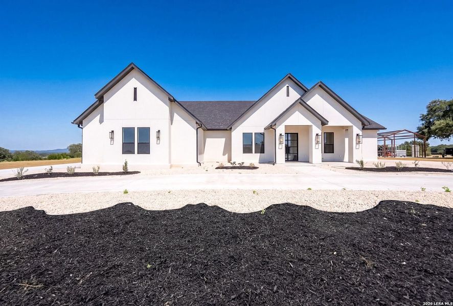 Front exterior of a new home in , Bandera, TX, highlighting curb appeal (Image 27). Front exterior of a new home in , Bandera, TX, highlighting curb appeal (Image 27).