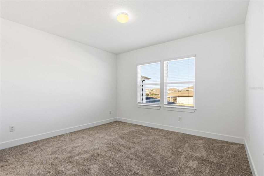 Spacious, unfurnished interior of a new home in Vida's Way, Wesley Chapel (Image 54).