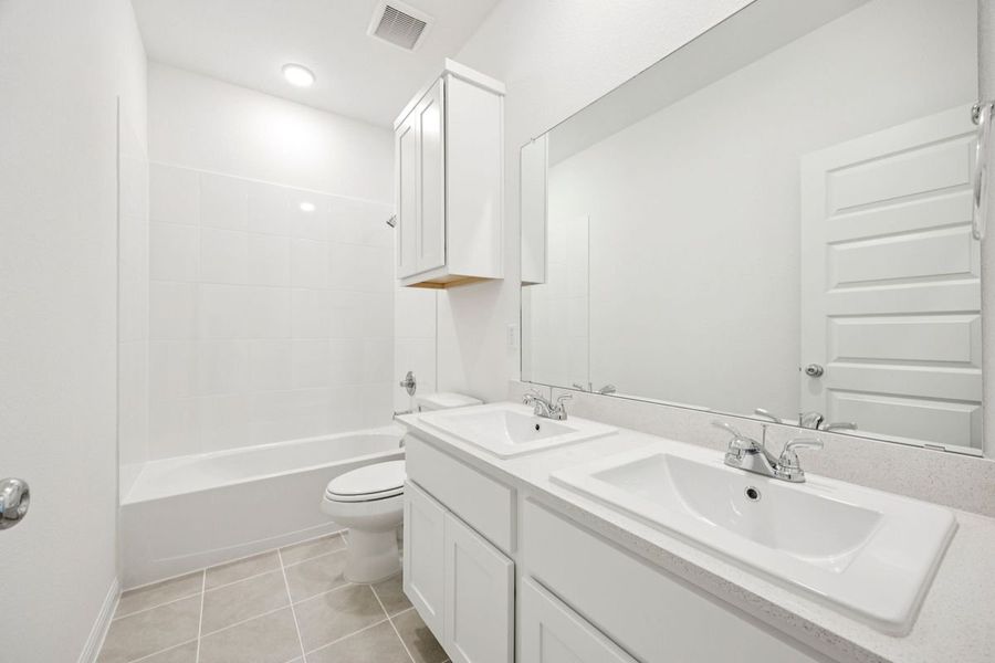 Bathroom in the Spruce home plan by Trophy Signature Homes - REPRESENTATIVE PHOTO