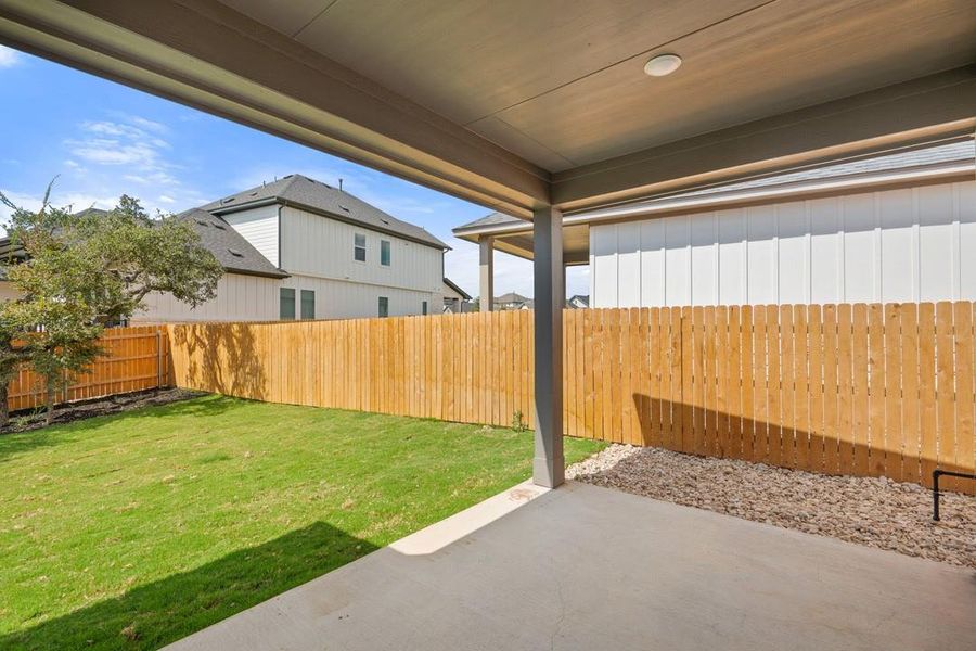 Exterior details and patio area of a home in Heritage, Dripping Springs (Image 27).