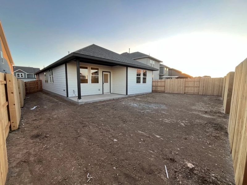 Exterior details and patio area of a home in Lariat, Liberty Hill (Image 8).