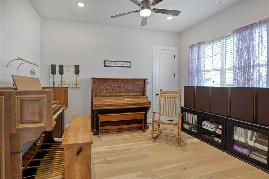 Sitting room with light wood-type flooring, recessed lighting, and a ceiling fan Sitting room with light wood-type flooring, recessed lighting, and a ceiling fan