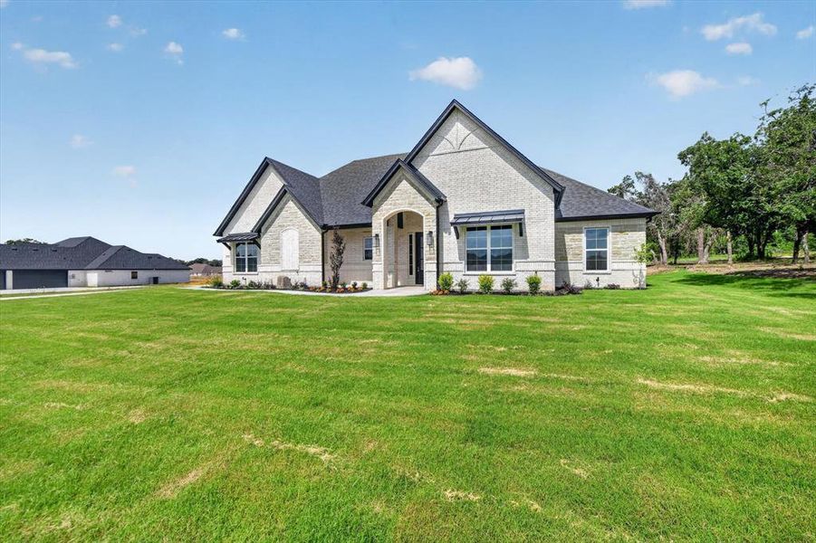 Front exterior of a new home in , Azle, TX, highlighting curb appeal (Image 23). Front exterior of a new home in , Azle, TX, highlighting curb appeal (Image 23).