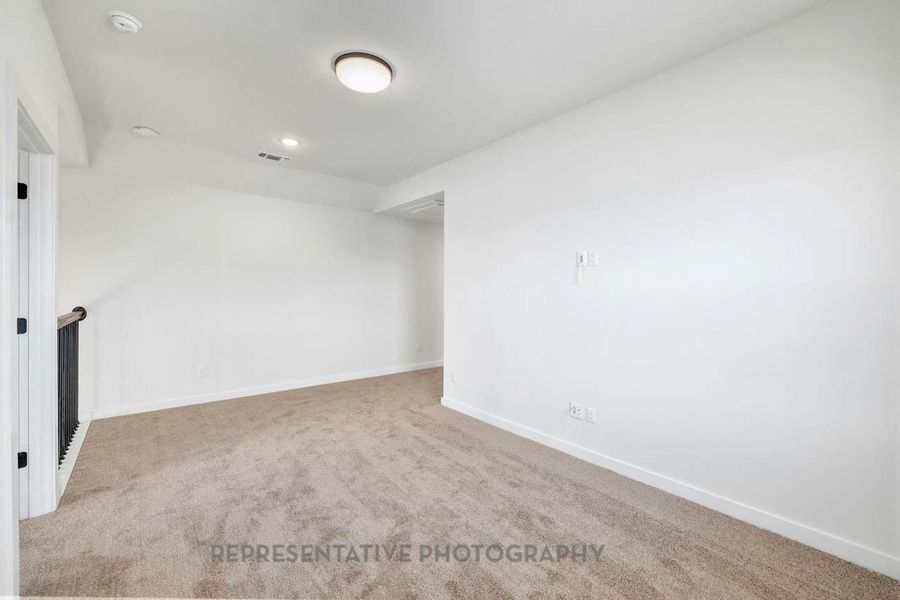 Unfurnished room featuring carpet floors and recessed lighting