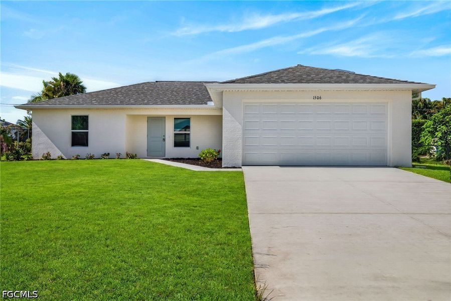 Front exterior of a new home in Cape Coral, Cape Coral, FL, highlighting curb appeal (Image 1). Front exterior of a new home in Cape Coral, Cape Coral, FL, highlighting curb appeal (Image 1).