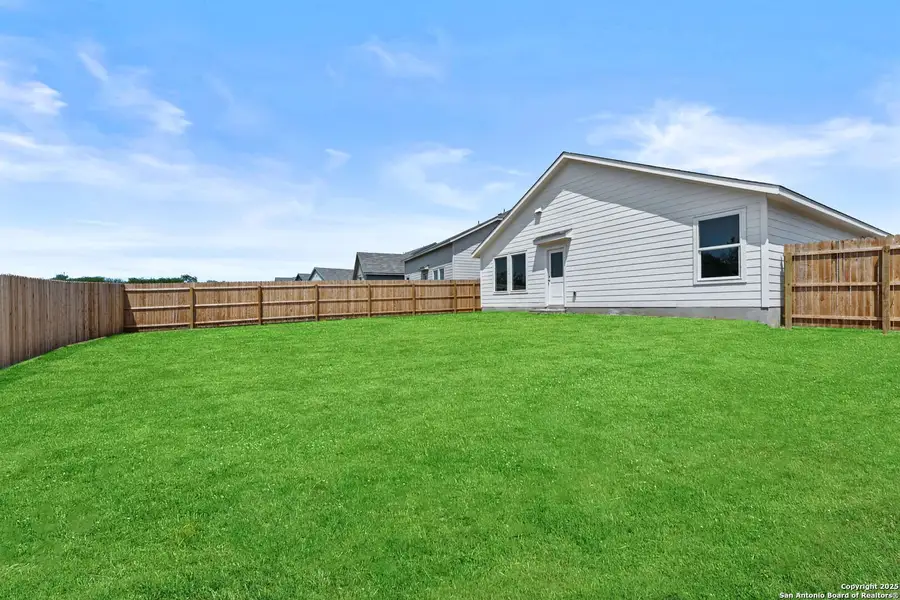 Exterior details and patio area of a home in Lodi Grove, Floresville (Image 2).
