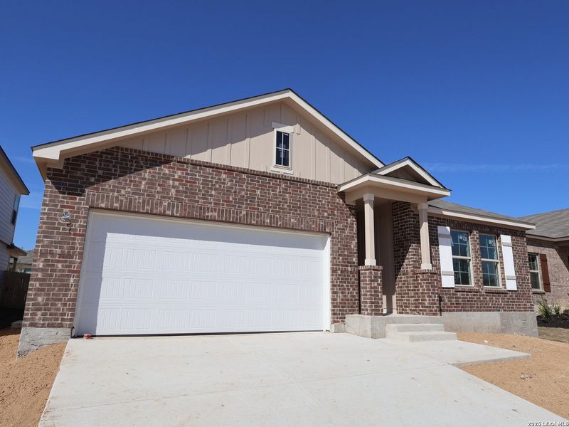 Front exterior of a new home in Paloma Park, Converse, TX, highlighting curb appeal (Image 2). Front exterior of a new home in Paloma Park, Converse, TX, highlighting curb appeal (Image 2).