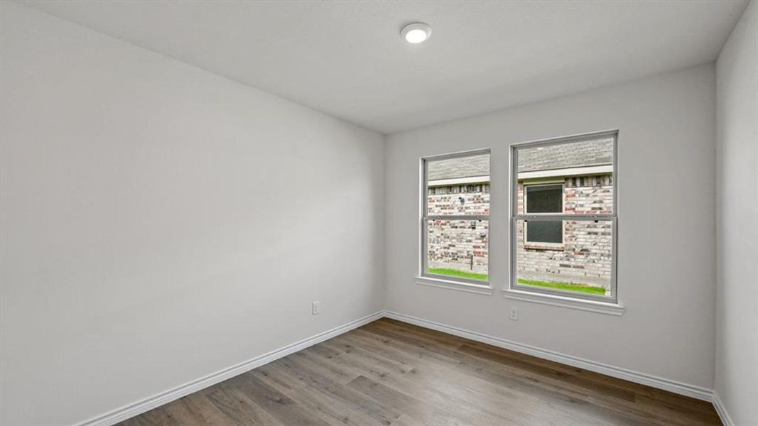 Empty room featuring light wood-style floors and baseboards