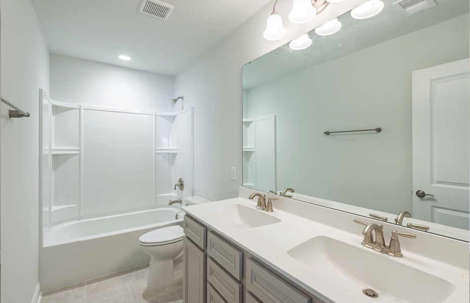Furnished interior view inside a new home in Monroe Preserve, Chapin (Image 11).