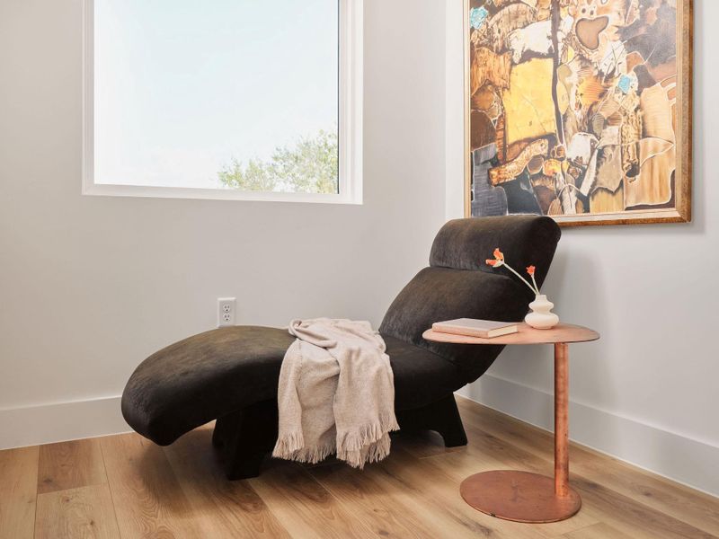 Living area featuring wood finished floors and baseboards