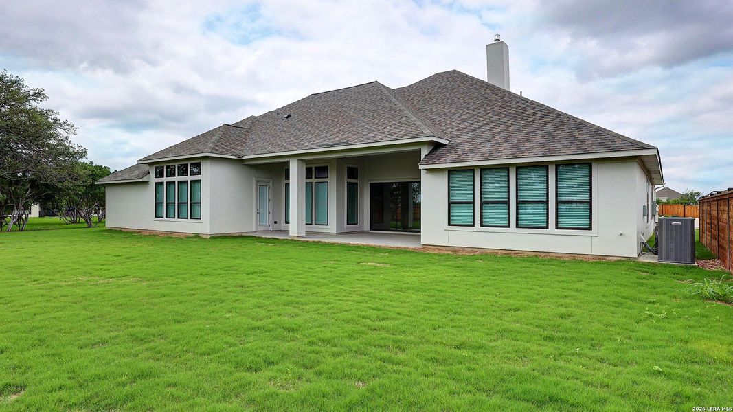 Exterior details and patio area of a home in Megan's Landing, Castroville (Image 4).