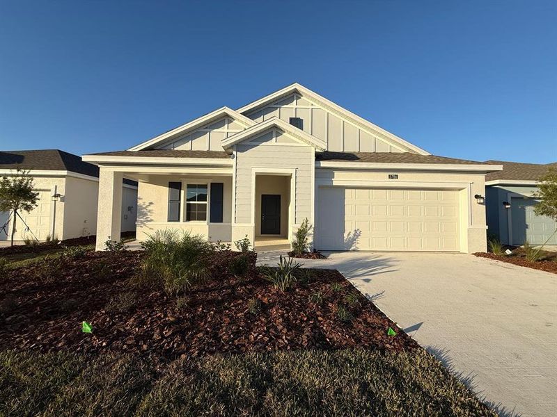 Front exterior of a new home in , Kissimmee, FL, highlighting curb appeal (Image 25).