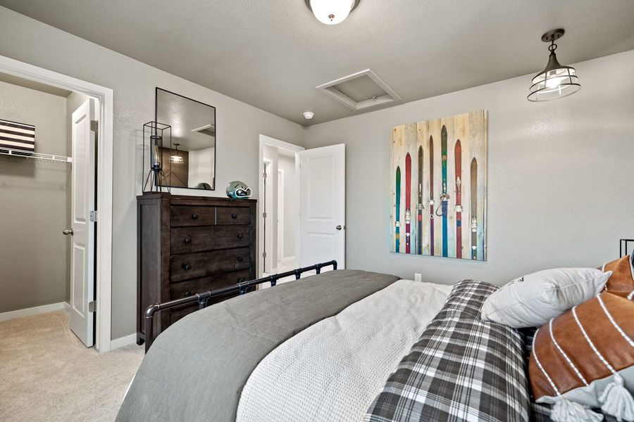 Representative furnished interior of a home built from the The Bellhaven by Challenger Homes in Sky Ranch - Highland Collection, Watkins (Image 27).