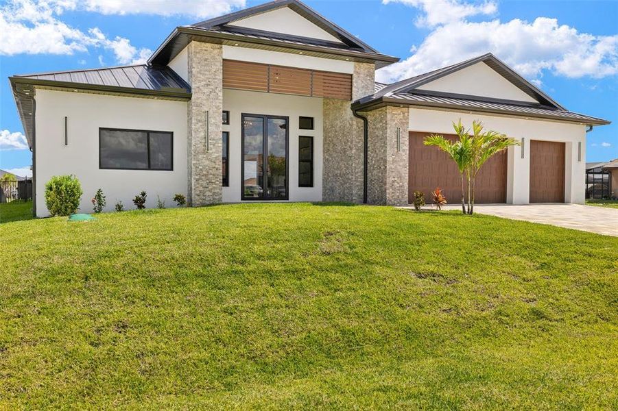 Front exterior of a new home in , Cape Coral, FL, highlighting curb appeal (Image 25).