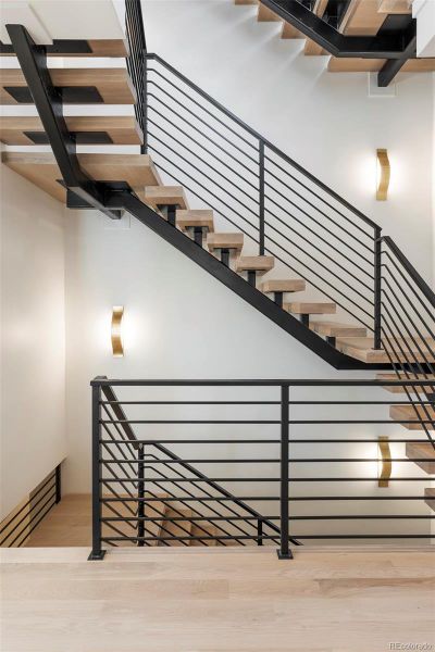 Striking staircase floats between the 4 floors