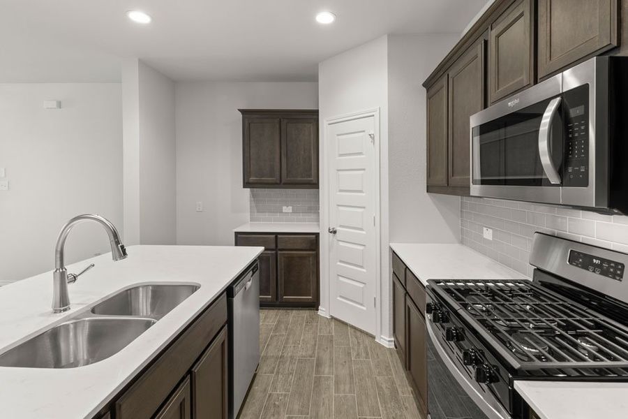 Representative exterior photo of a completed home built from the Hickory by Impression Homes in Northspur, Terrell, TX (Image 5). Representative exterior photo of a completed home built from the Hickory by Impression Homes in Northspur, Terrell, TX (Image 5).