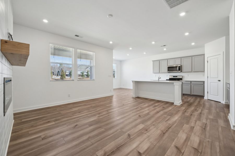 A large kitchen with white cabinets. A large kitchen with white cabinets.