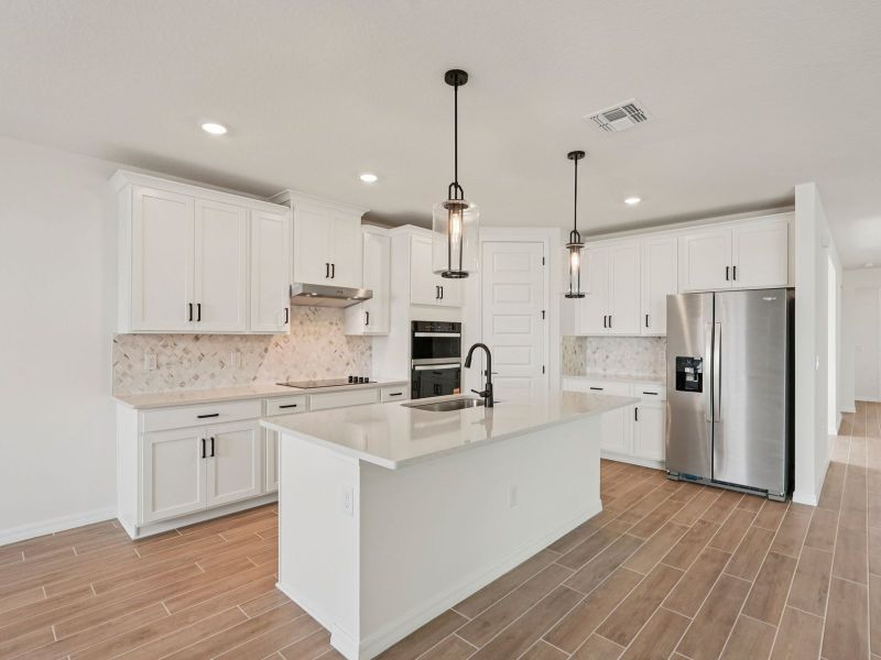 Furnished interior view inside a new home in Oakfield Trails - Signature Series, Parrish (Image 5). Furnished interior view inside a new home in Oakfield Trails - Signature Series, Parrish (Image 5).