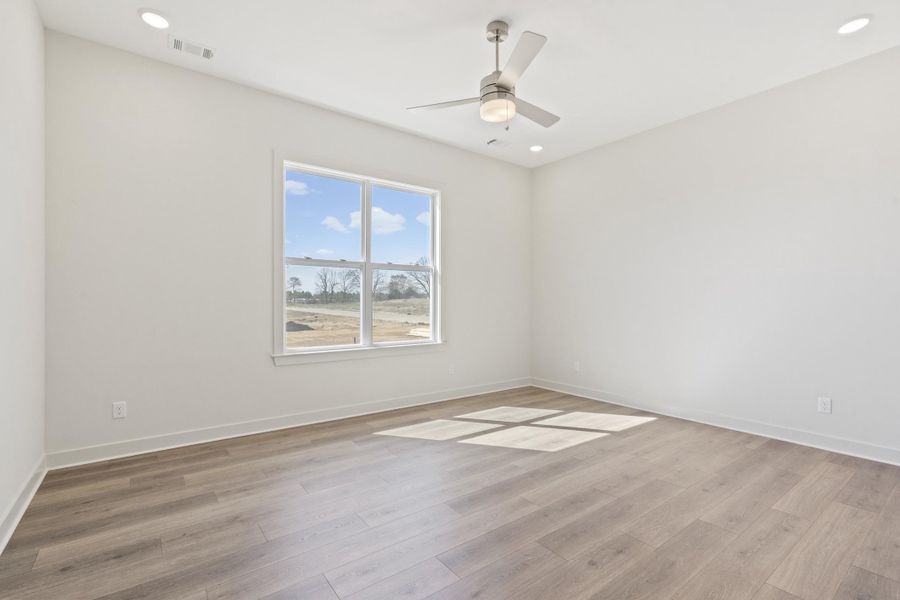 Unfurnished room with light wood-type flooring, recessed lighting, and a ceiling fan