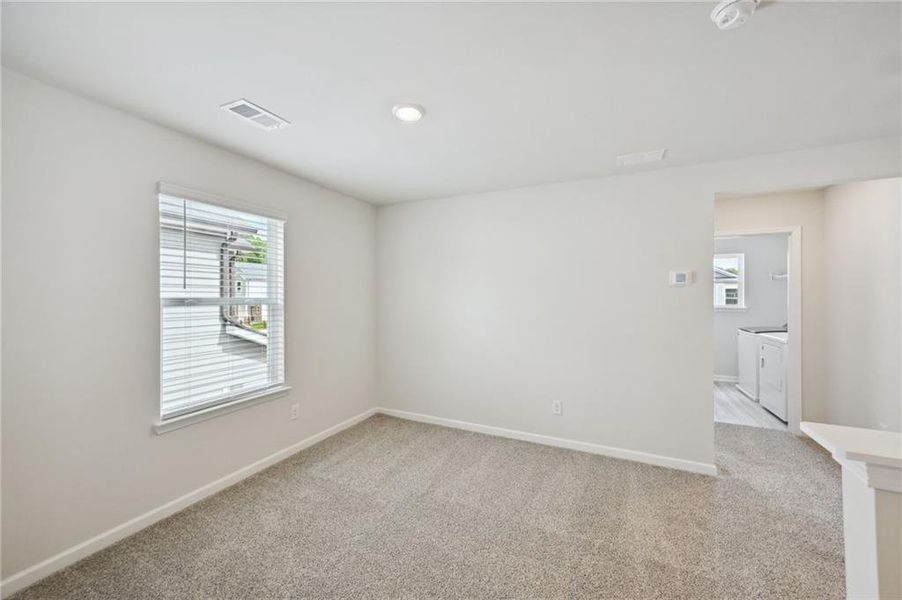 Spacious, unfurnished interior of a new home in Hawthorne Station, College Park (Image 30).