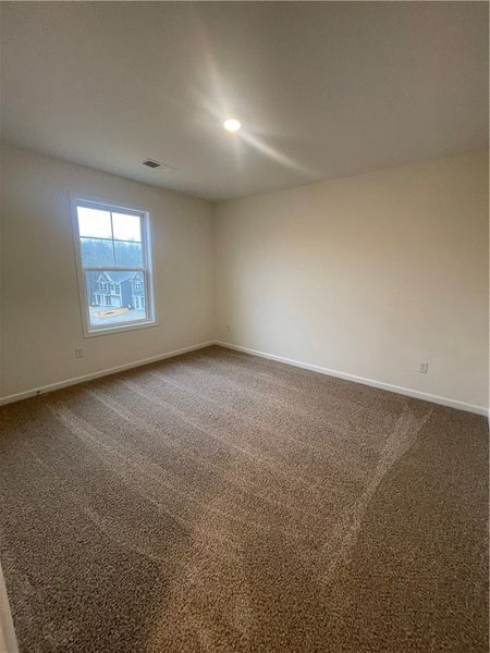 Spacious, unfurnished interior of a new home in Springwood Grove, Central (Image 30).