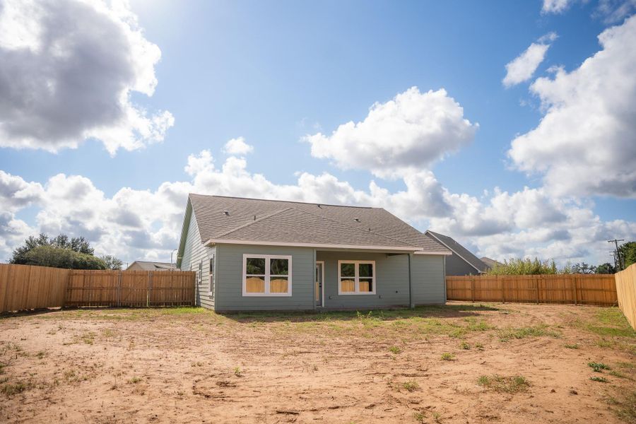Front exterior of a new home in , Smithville, TX, highlighting curb appeal (Image 22).