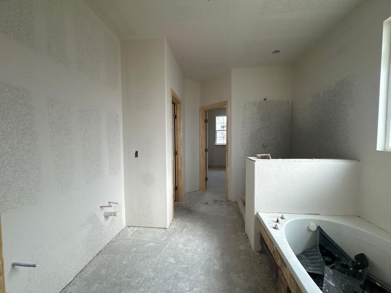 Full bathroom featuring a garden tub and walk in shower Full bathroom featuring a garden tub and walk in shower