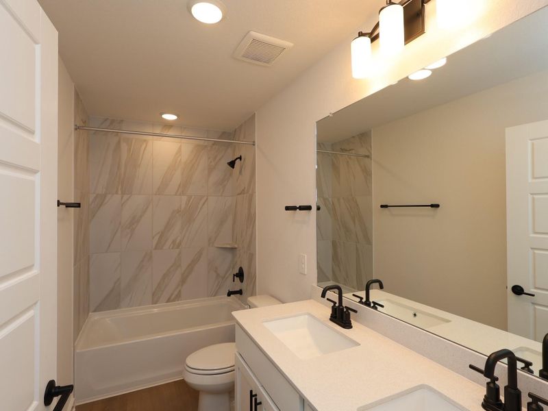 Furnished interior view inside a new home in Sorella, Tomball (Image 8).