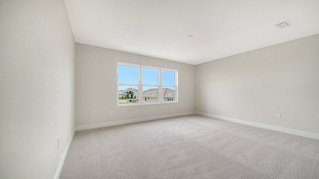 Spacious, unfurnished interior of a new home in Palm Grove Real Estate and Homes for Sale in Lakewood Ranch, FL - Neal Communities, Bradenton (Image 8).
