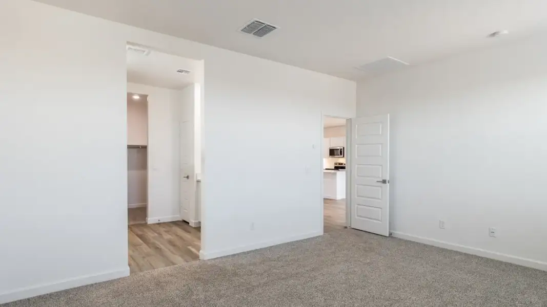 Spacious, unfurnished interior of a new home in Zanjero Pass, Waddell (Image 28).