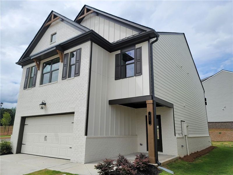 Front exterior of a new home in Kentmere, Auburn, GA, highlighting curb appeal (Image 2).