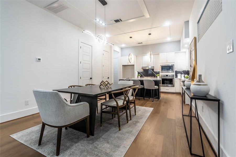 Corner view of the dining area. The spacious layout allows for various sizes and styles of dining tables, along with the addition of a buffet.