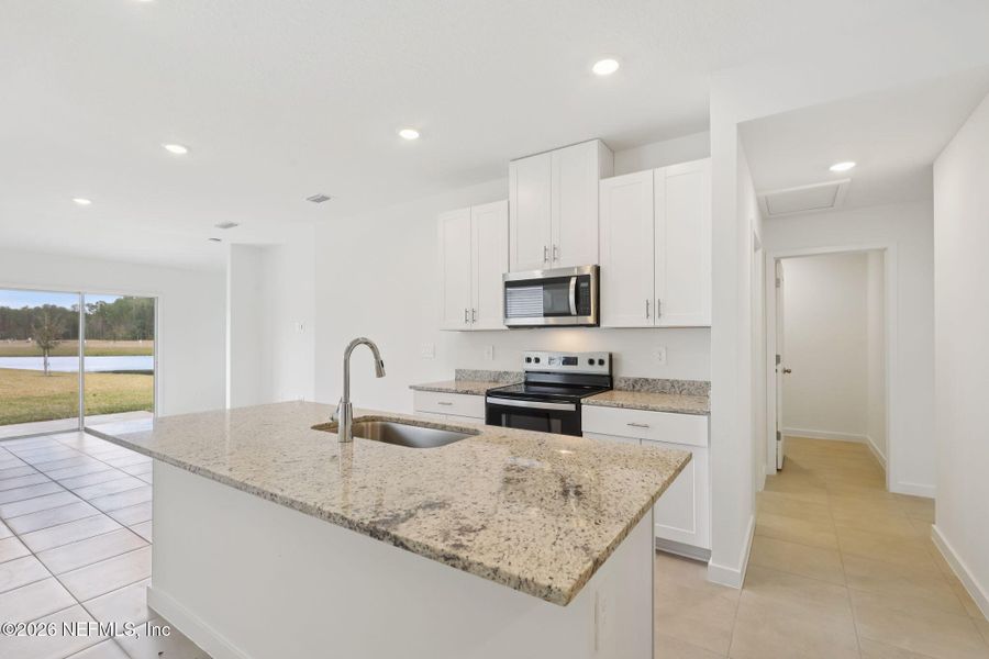 Furnished interior view inside a new home in Flagler Village - Classic Series, Palm Coast (Image 9).